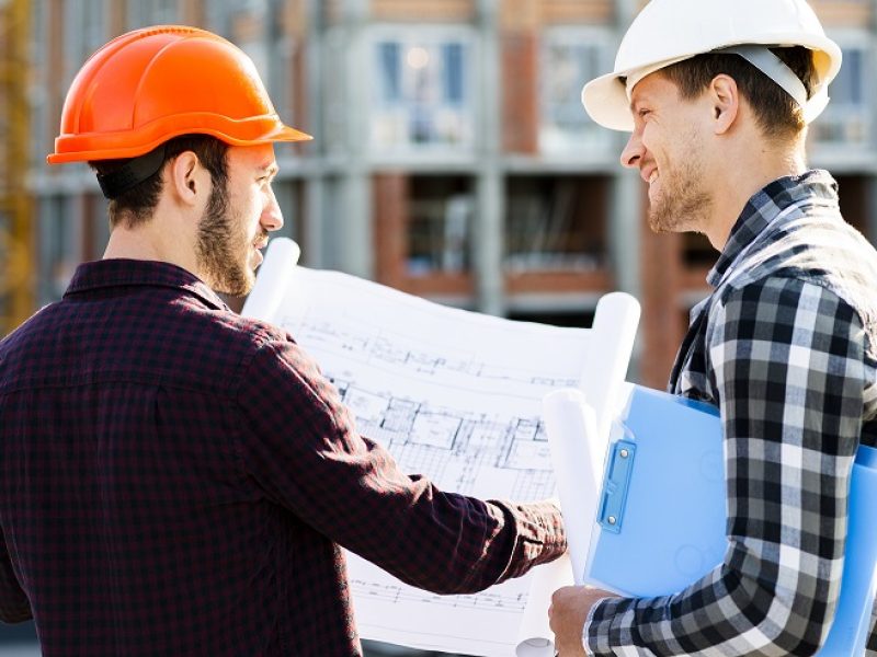 close-up-back-view-engineer-architect-supervising-construction