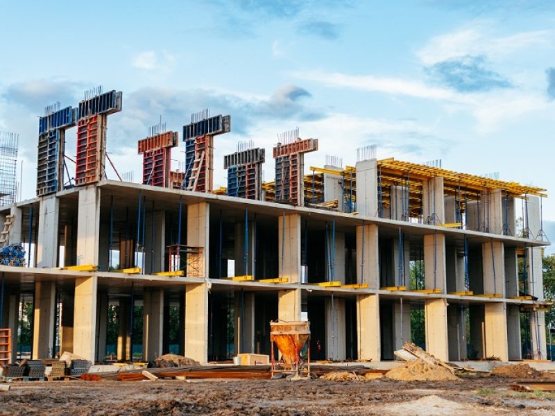 construction of multi-storey building using modern technologies of monolithic housing construction. residential building with apartments shopping center. concrete cement formwork, professional tools