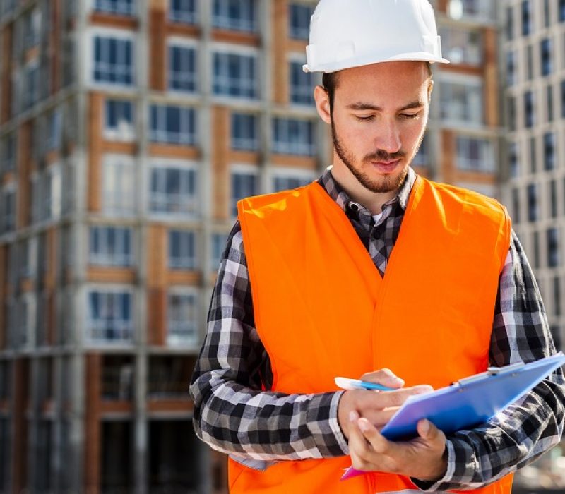medium-shot-portrait-construction-engineer-holding-clipboard