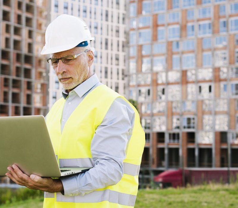 side-view-old-man-with-laptop-outdoors