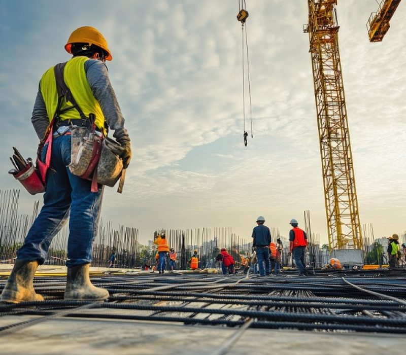 Workers at construction site against sky, high quality picture, bright lighting, high resolution, perfect composition, with space for text or copy space, with text area, high detail, 8k --ar 3:2 --v 6.1 Job ID: d64666b7-318d-4992-a45b-c42f34d82575